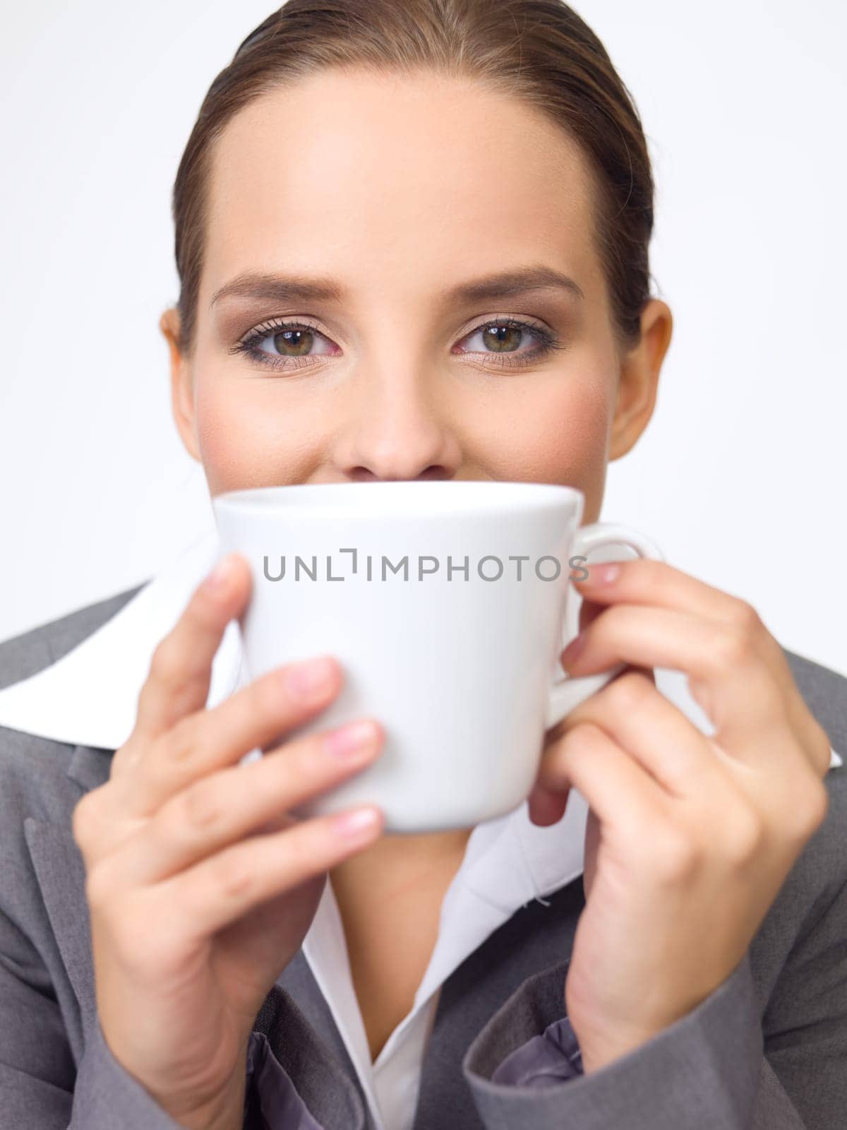 Portrait of beautiful and young business woman with coffee cup