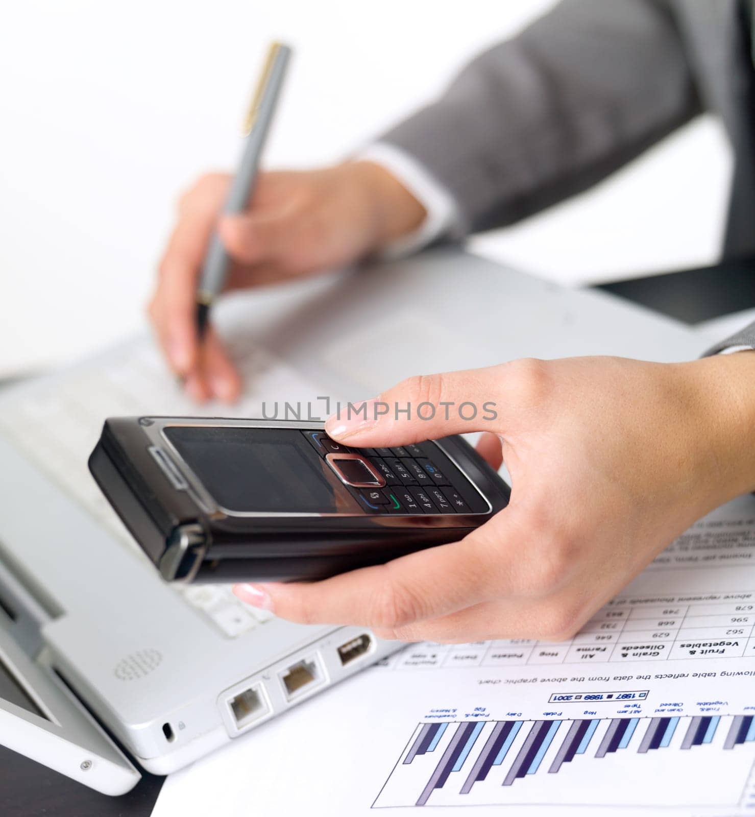 Portrait of beautiful and young business woman working on laptop