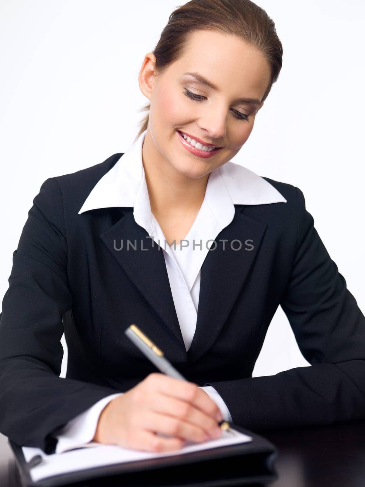 Portrait of beautiful and young business woman working at the desk