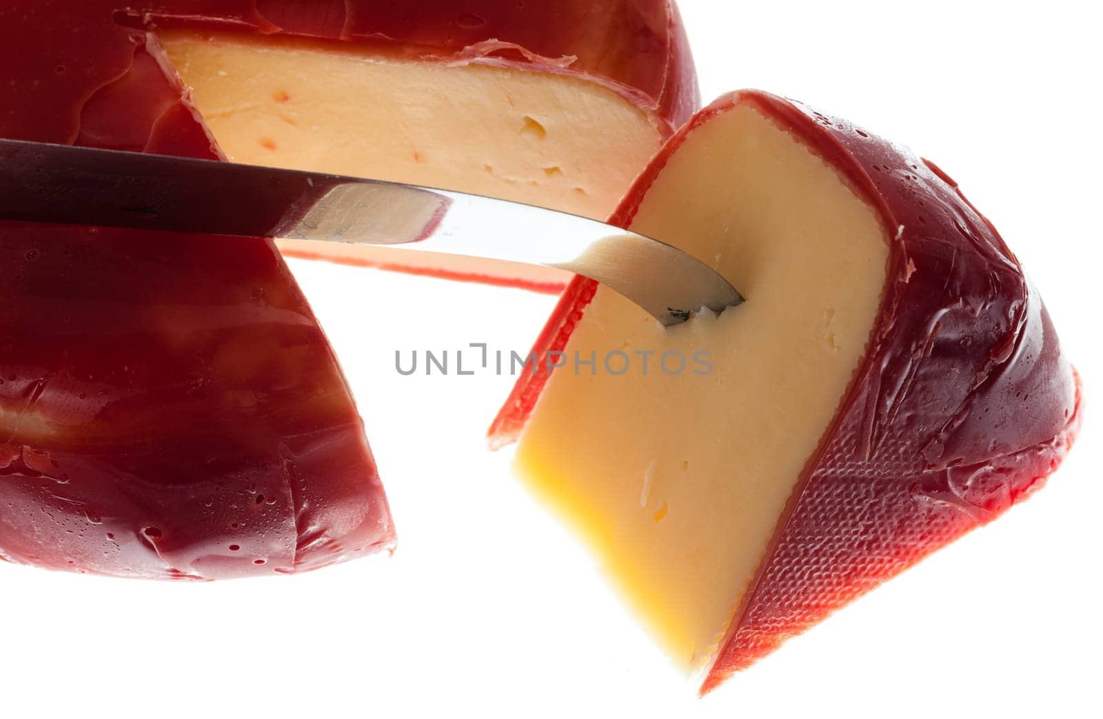 Circular round dutch covered in red wax protection with knife