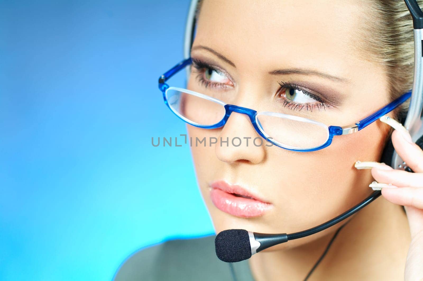 Beautiful young woman working as Call Center operator