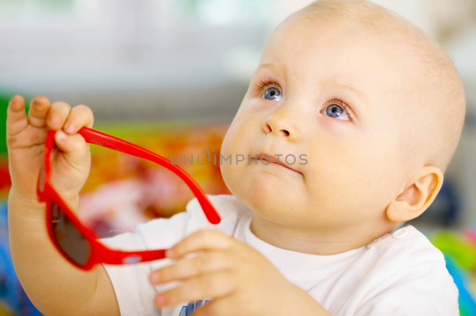 Portrait of sweet little baby boy with sunglasses