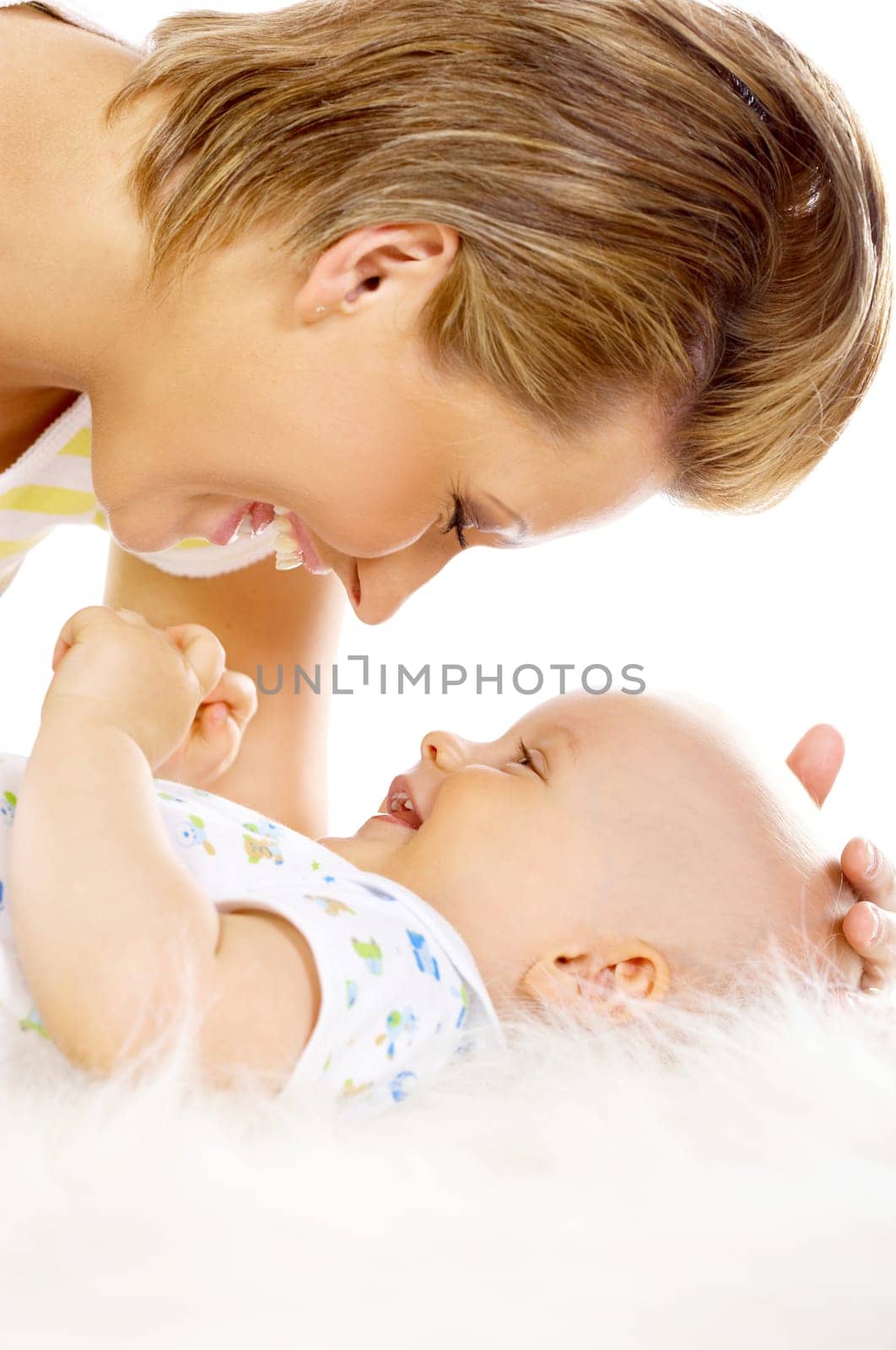 Young attractive mother kissing cute little baby