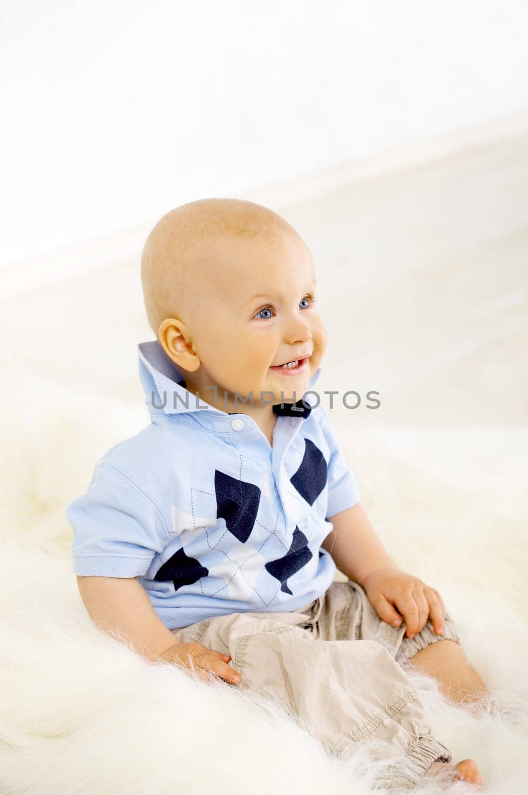 Portrait of sweet little baby boy on white background