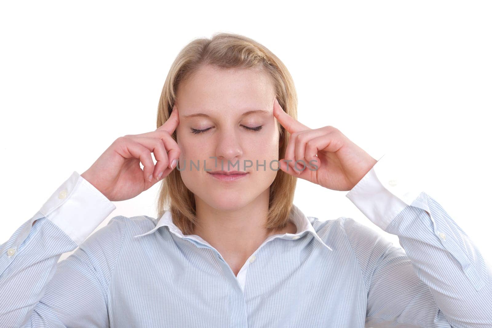 Young blonde woman with closed eyes holding her fingers to her temples