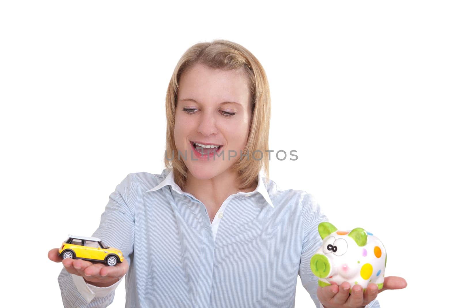 Young blonde woman holding a car in one hand and a piggy bank in the other
