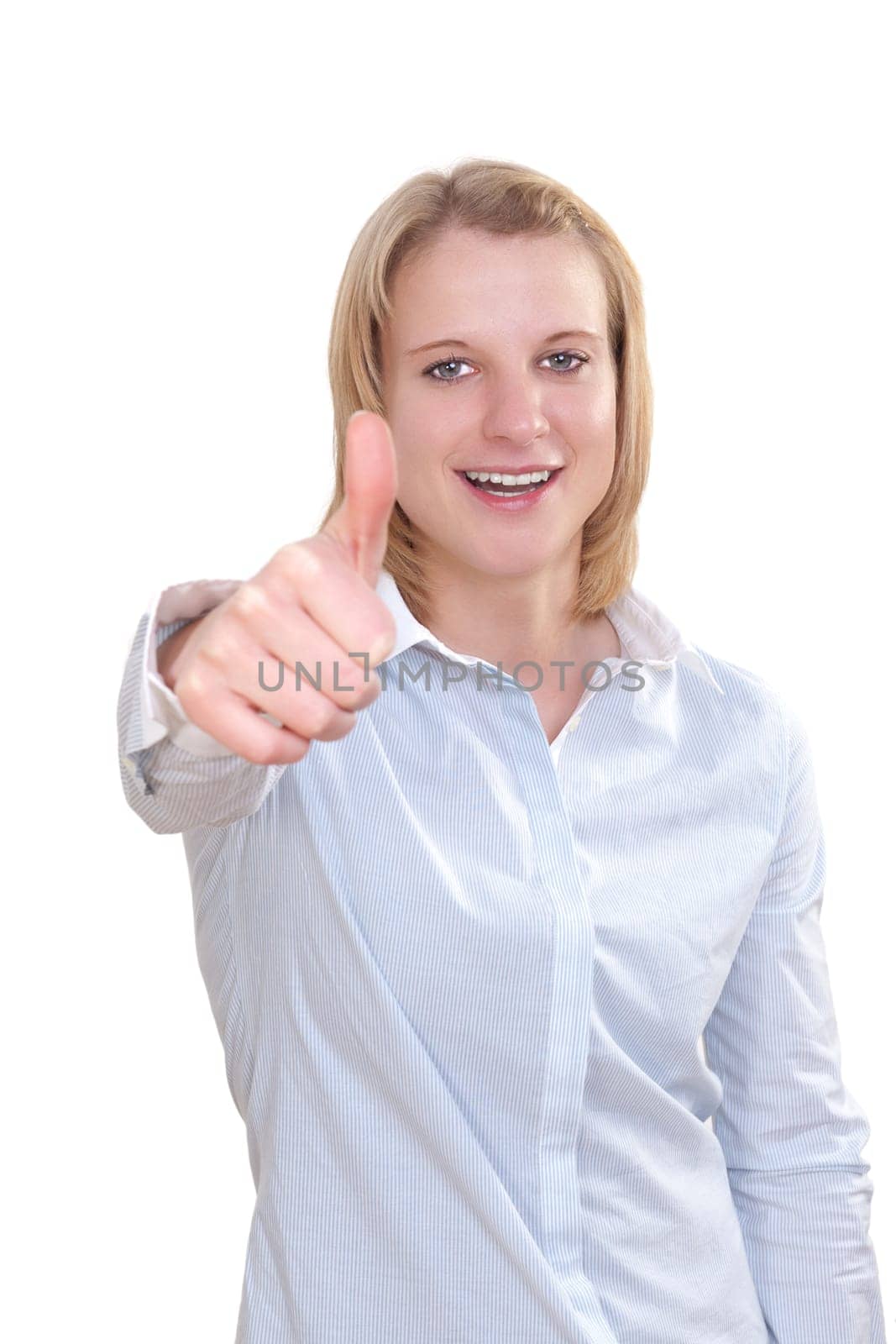 Young attractive woman holding thumbs up against white background