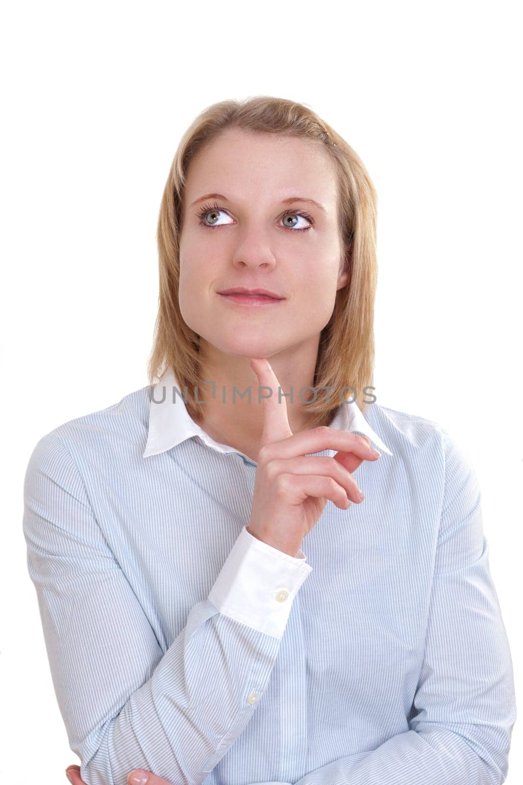 Young blonde woman thoughtfully resting her head with her index finger
