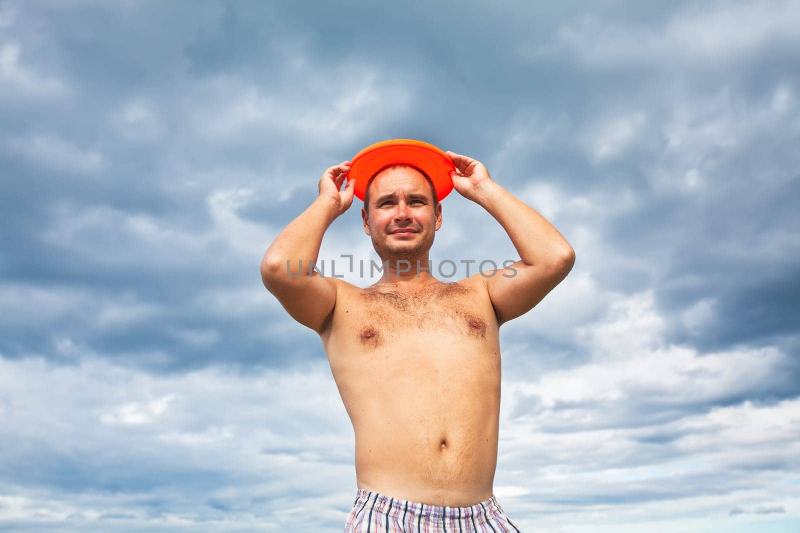 Funny man with a frisbee like nimbus