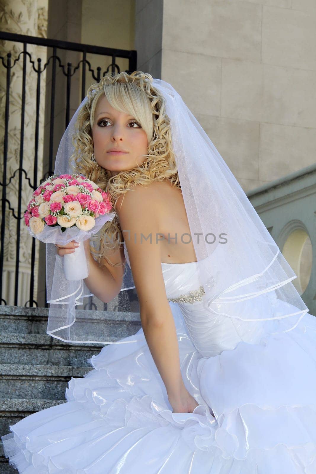 Beautiful young woman in white wedding dress