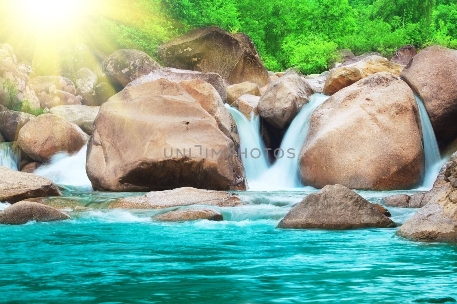 Waterfall in tropical forest at sunny day