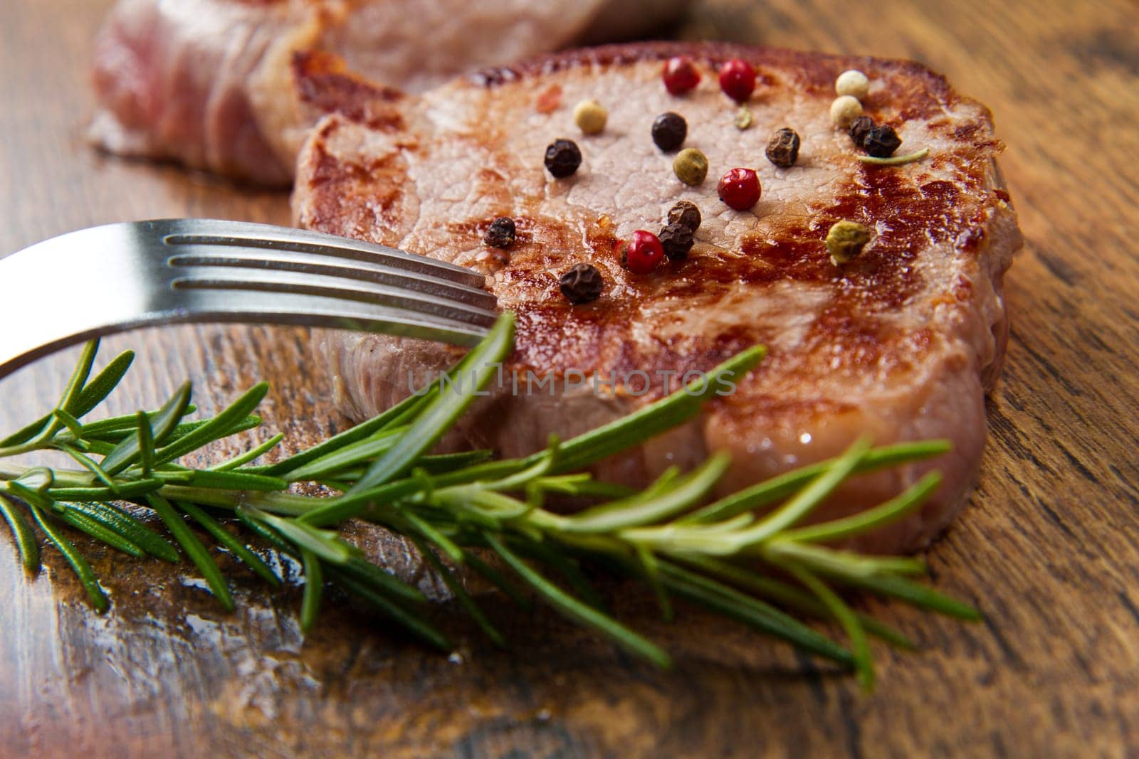 grilled meat fillet on wooden background