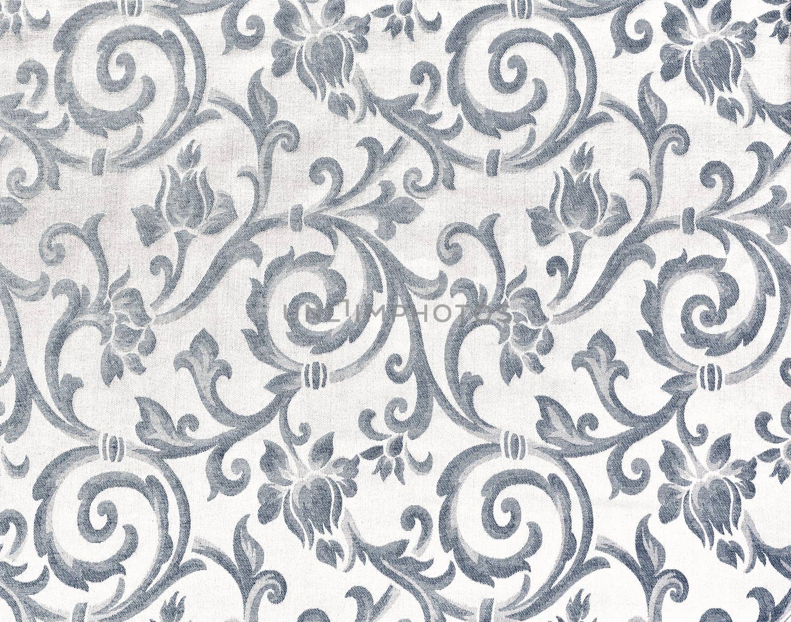 Abstract background of a heavy grey brocade fabric with interwoven repeat design.