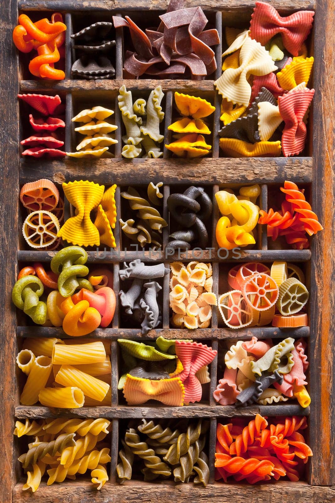 Different colored Pasta in an old letter-box