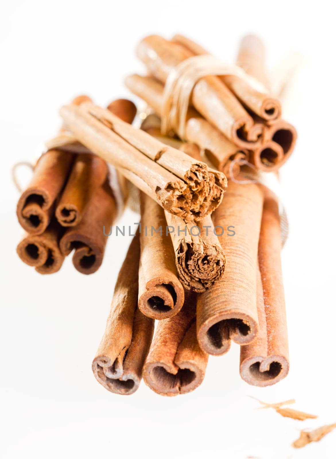 a group cinnamon sticks isolated on white. Different cinnamon sticks on white background.