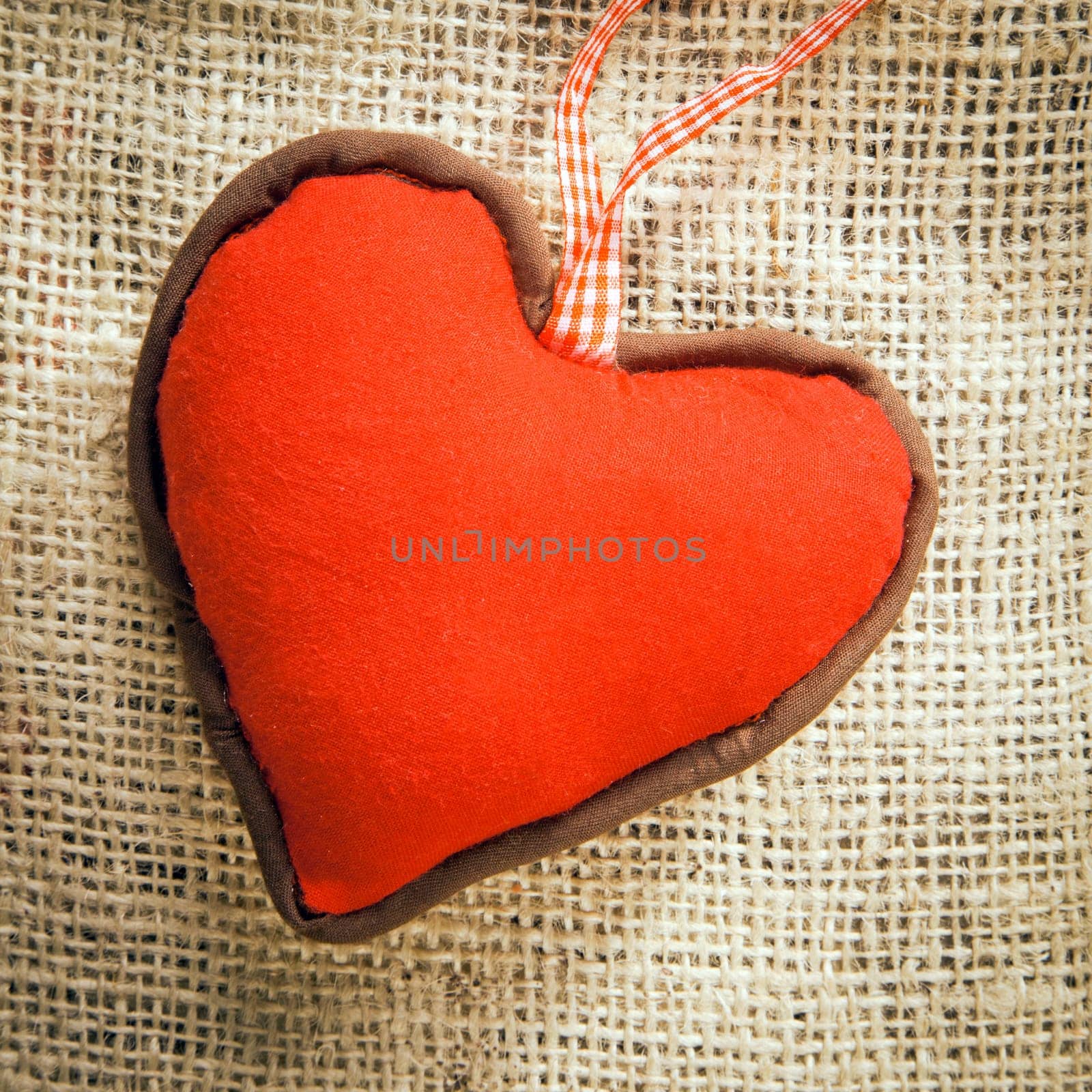 a red Heart on a textile background