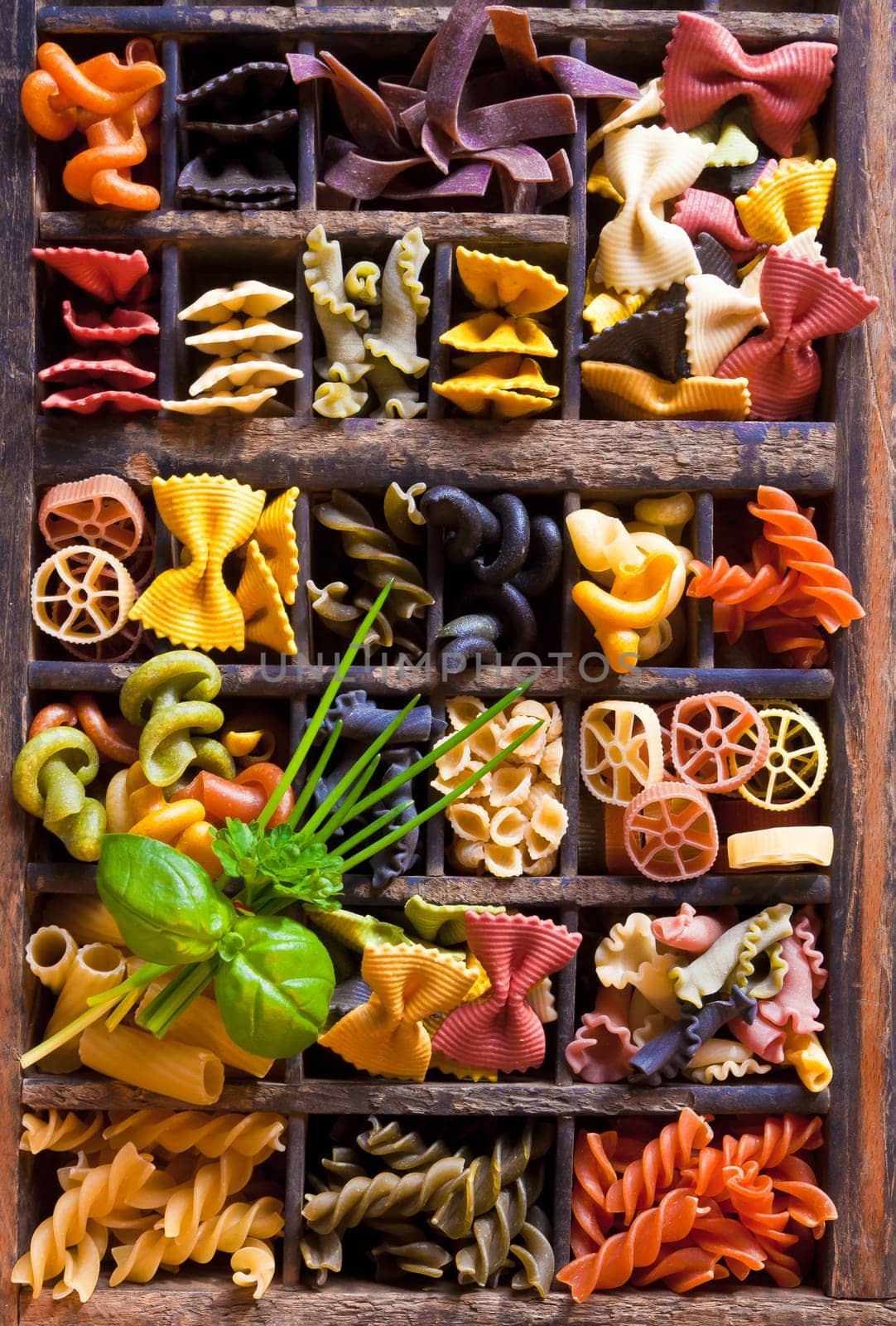 Different colored Pasta in an old letter-box