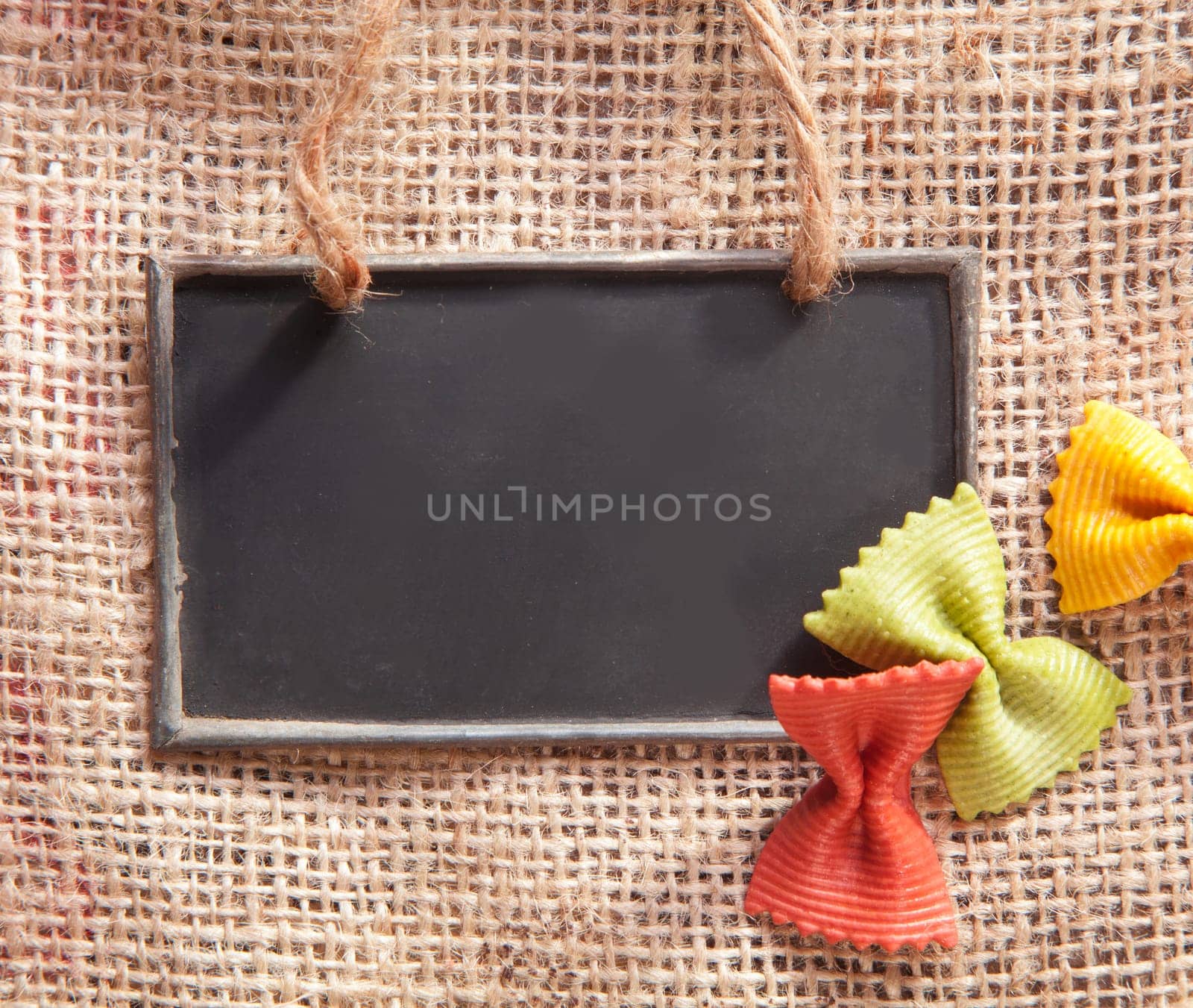 a chalkboard on a textile coffee bag with pasta