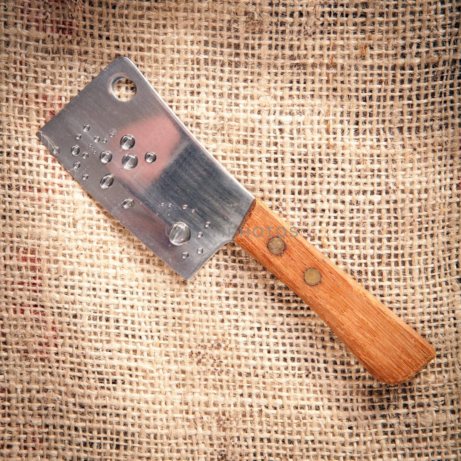 chopping-knife on a fabric coffee bag background