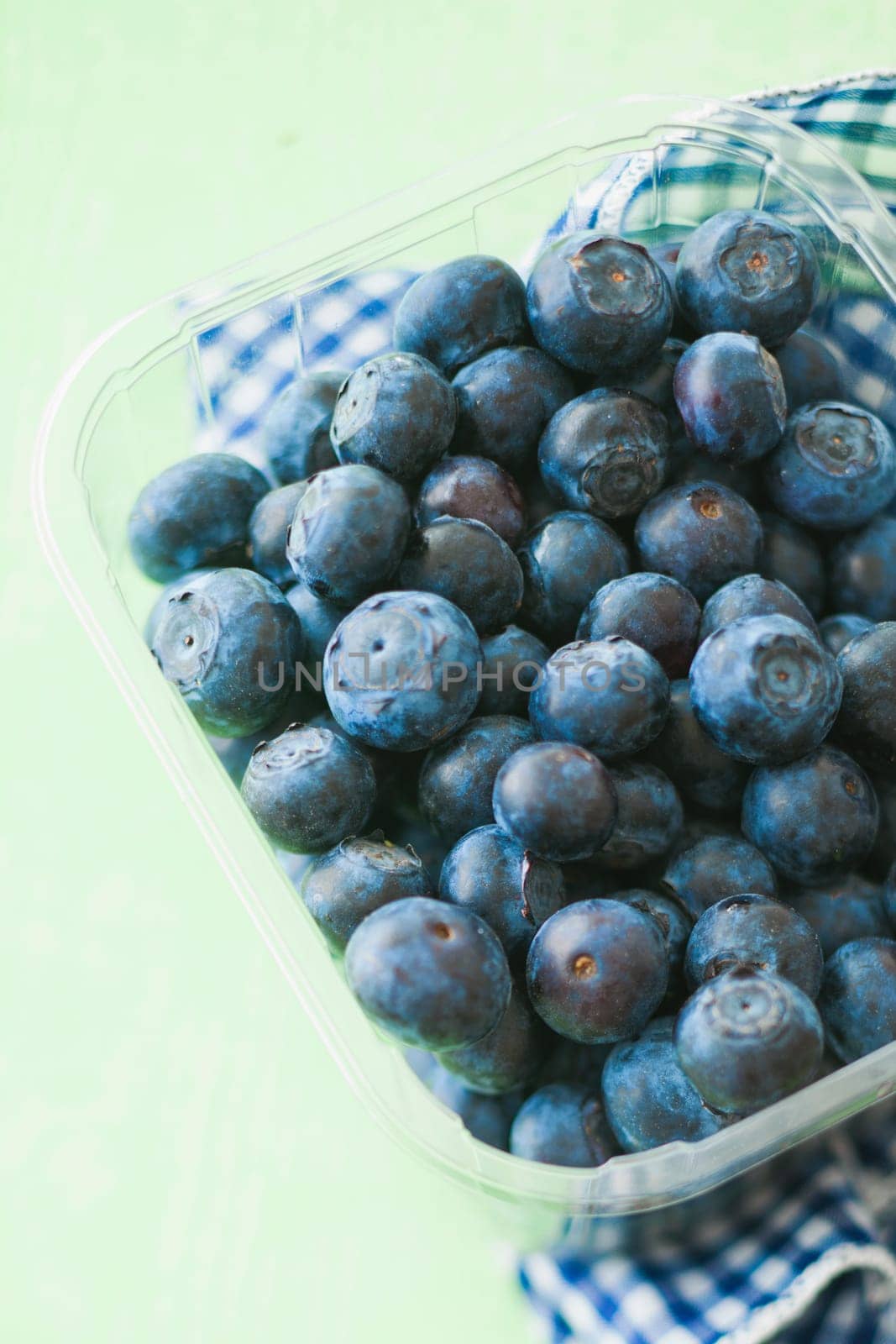 Blueberries on green background for springtime