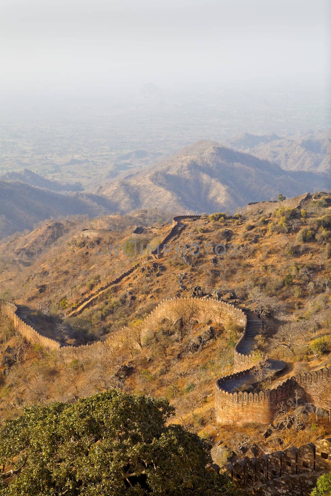 Portrait of stunning Kumbhalghar Fort walls seen stretching over the hilly Rajasthan terrain and into the distance for 34 kilometers