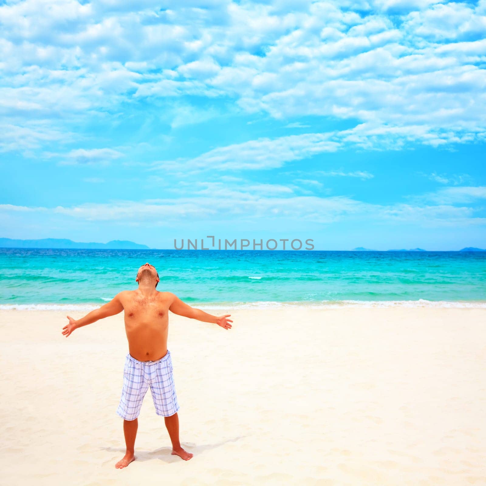 Young man enjoy sun near the ocean