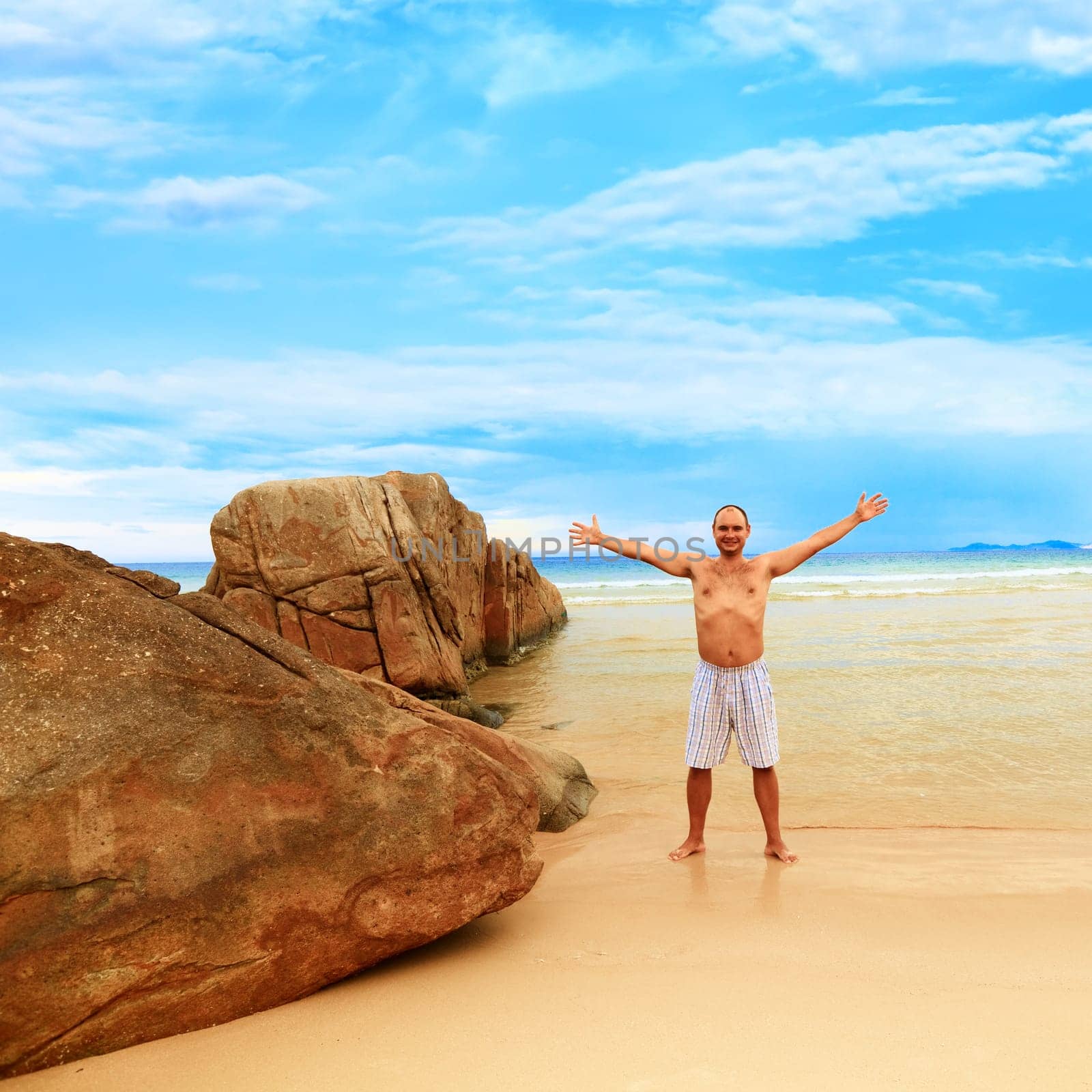 Young man enjoy sun near the ocean