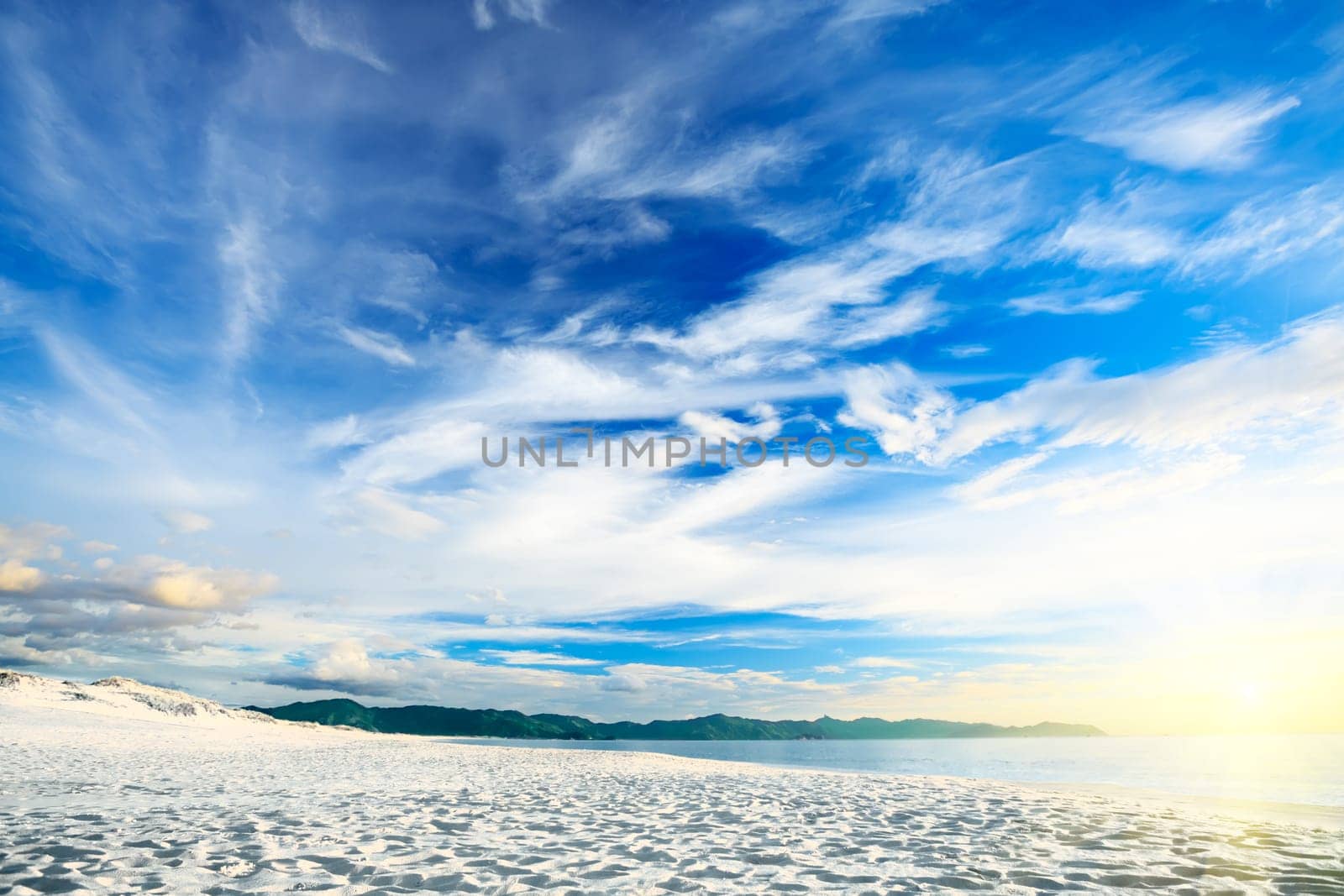 Beautiful sandy tropical beach at sunrise time