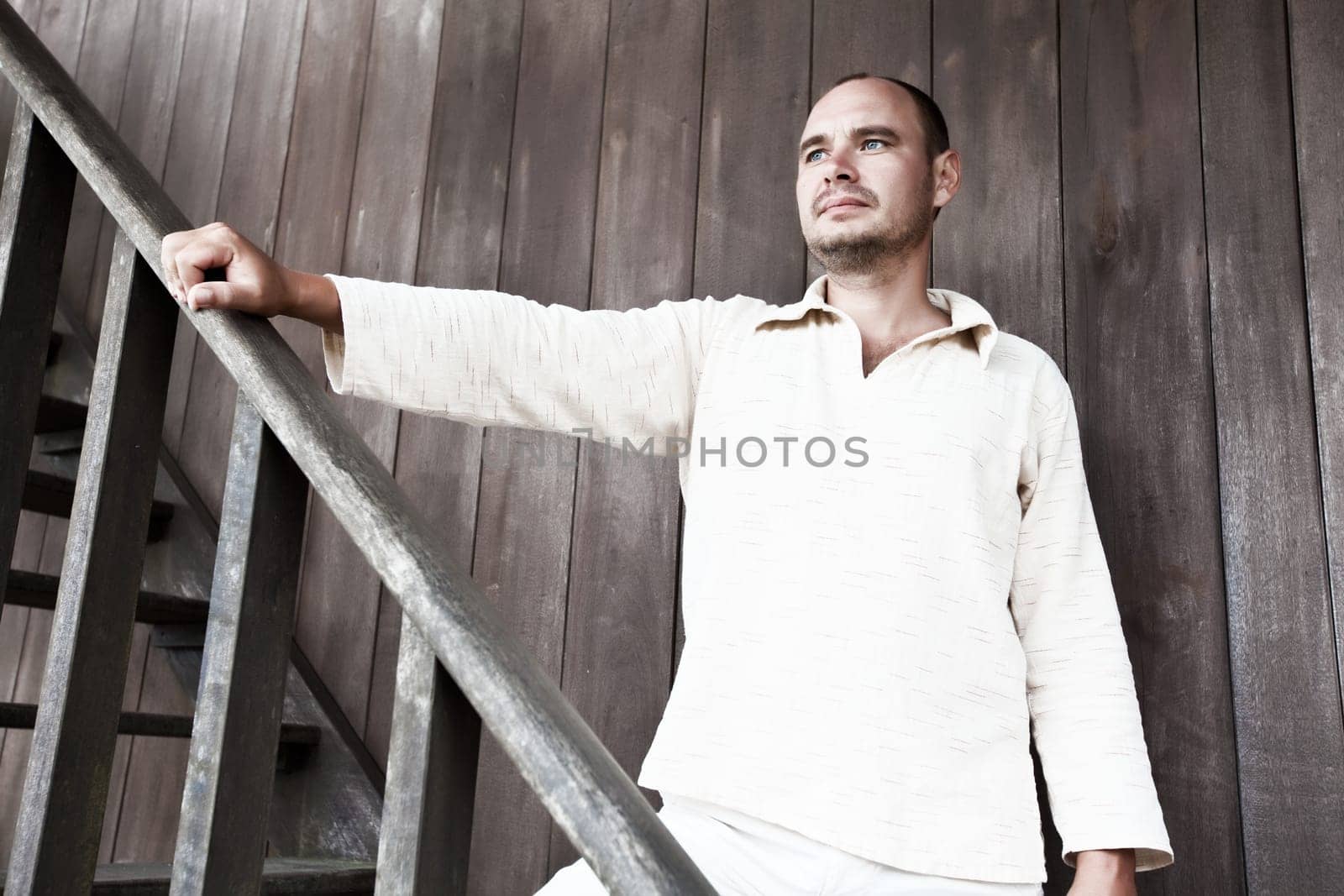 Men at the woodwn house. Retro style image
