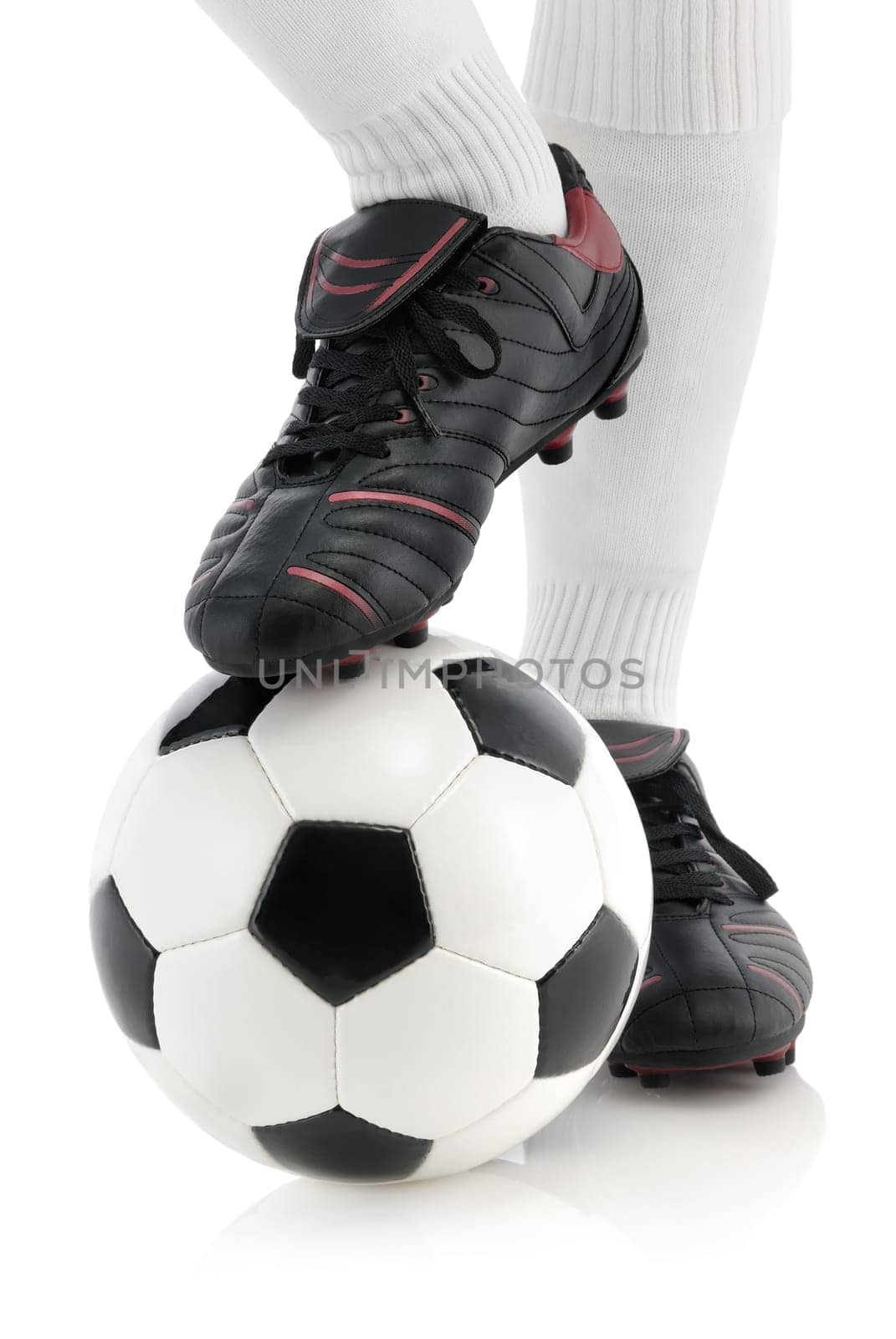 Foot of a footballer on the ball,isolated on white