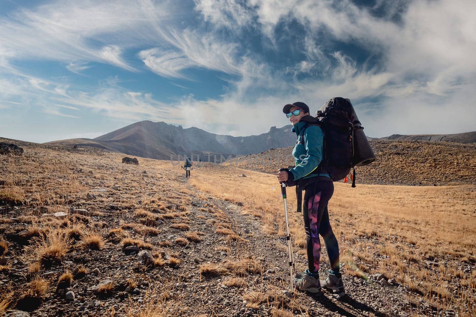 Woman on road leading to volcano in Turkey by tan4ikk1