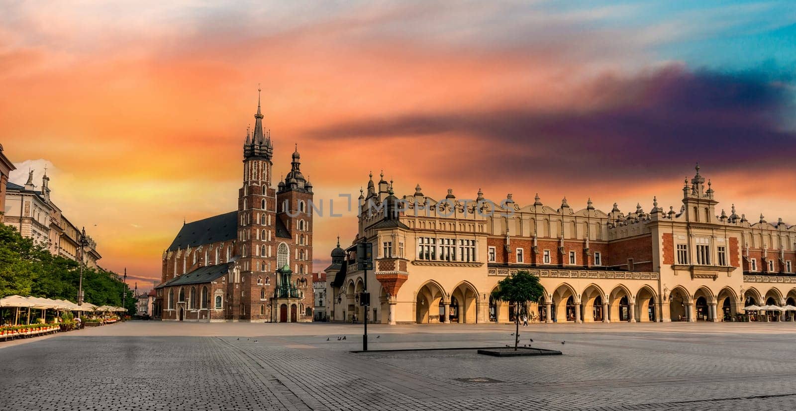 POLAND, KRAKOW- JULY 01: Breathtaking eastern european cobbled square arched building, on a cloudy day in Krakow Poland on July 01, 2015