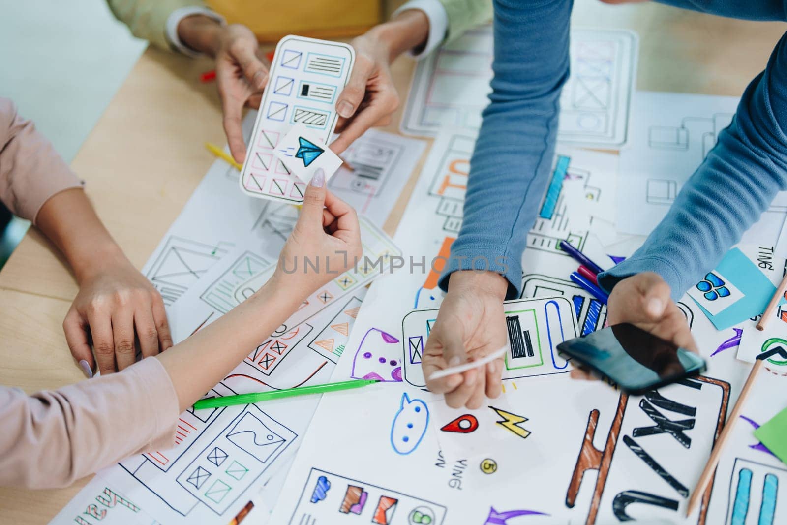 Team of Creative Web, Graphic Designer planning for mobile phone, drawing website ux ui app for mobile phone application and development template layout, process to developing prototype wireframe. by Manastrong