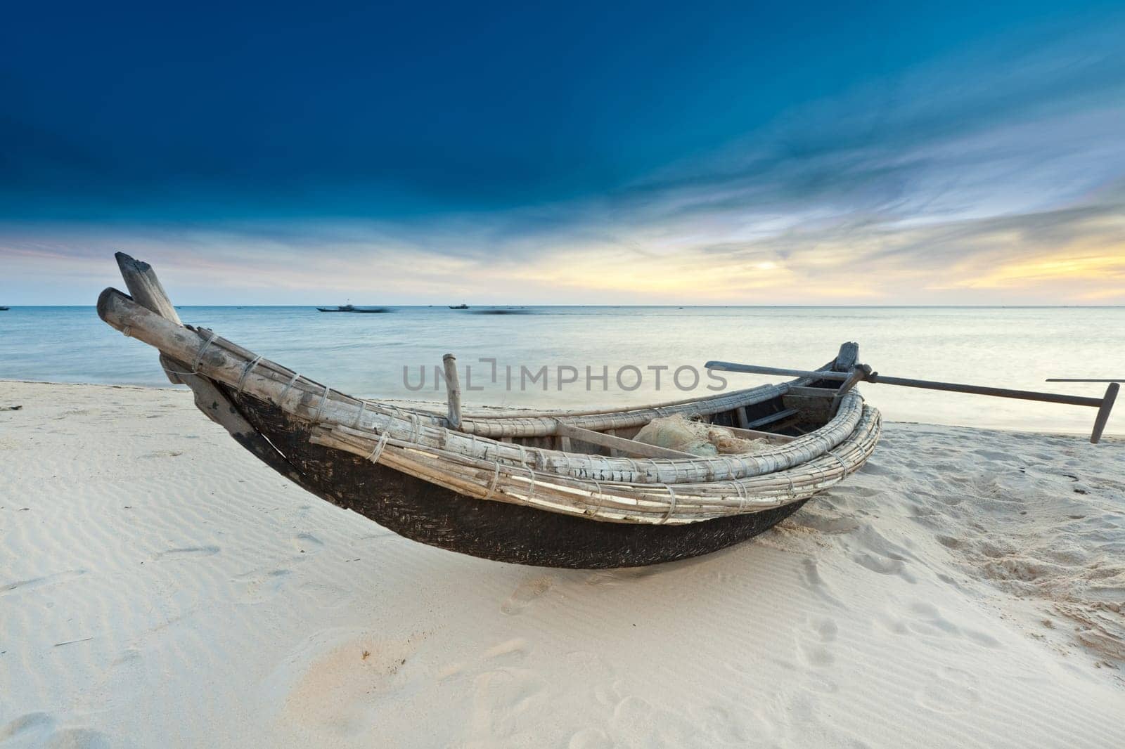 Old fisherman boat at sunrise time. Hue province. Vietnam