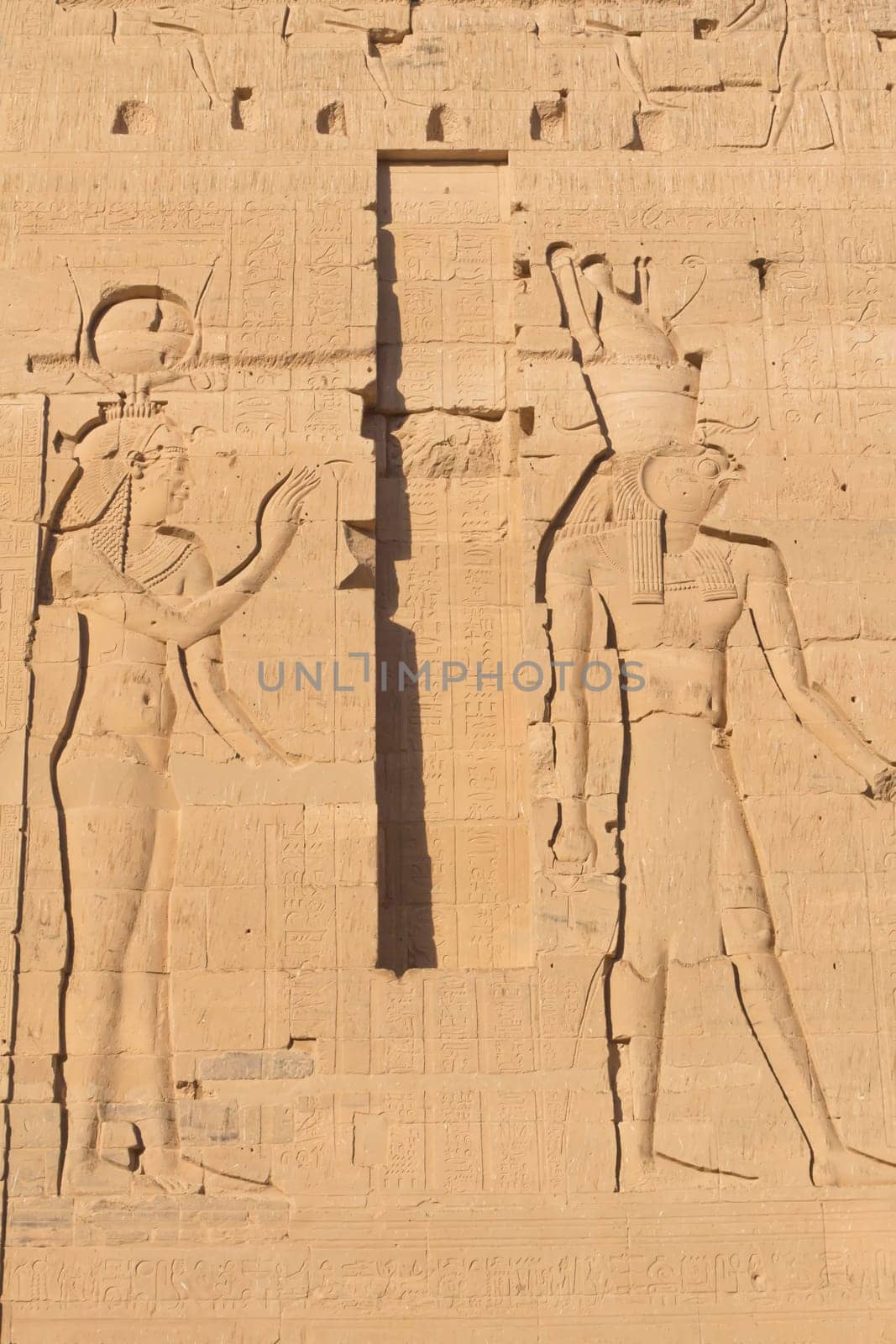Carving of Egyptian god on pylon in Temple of Isis at Philae, Egypt