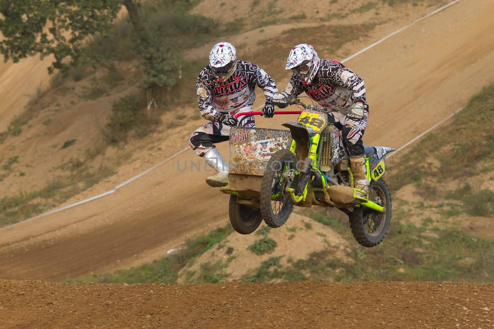 MOHELNICE, CZECH REPUBLIC - SEPTEMBER 17. Unidentified racers rides a sidecar in the "Sidecarcross Championship of Czech Republic"" on September 17, 2011 in the town of Mohelnice, Czech Republic."