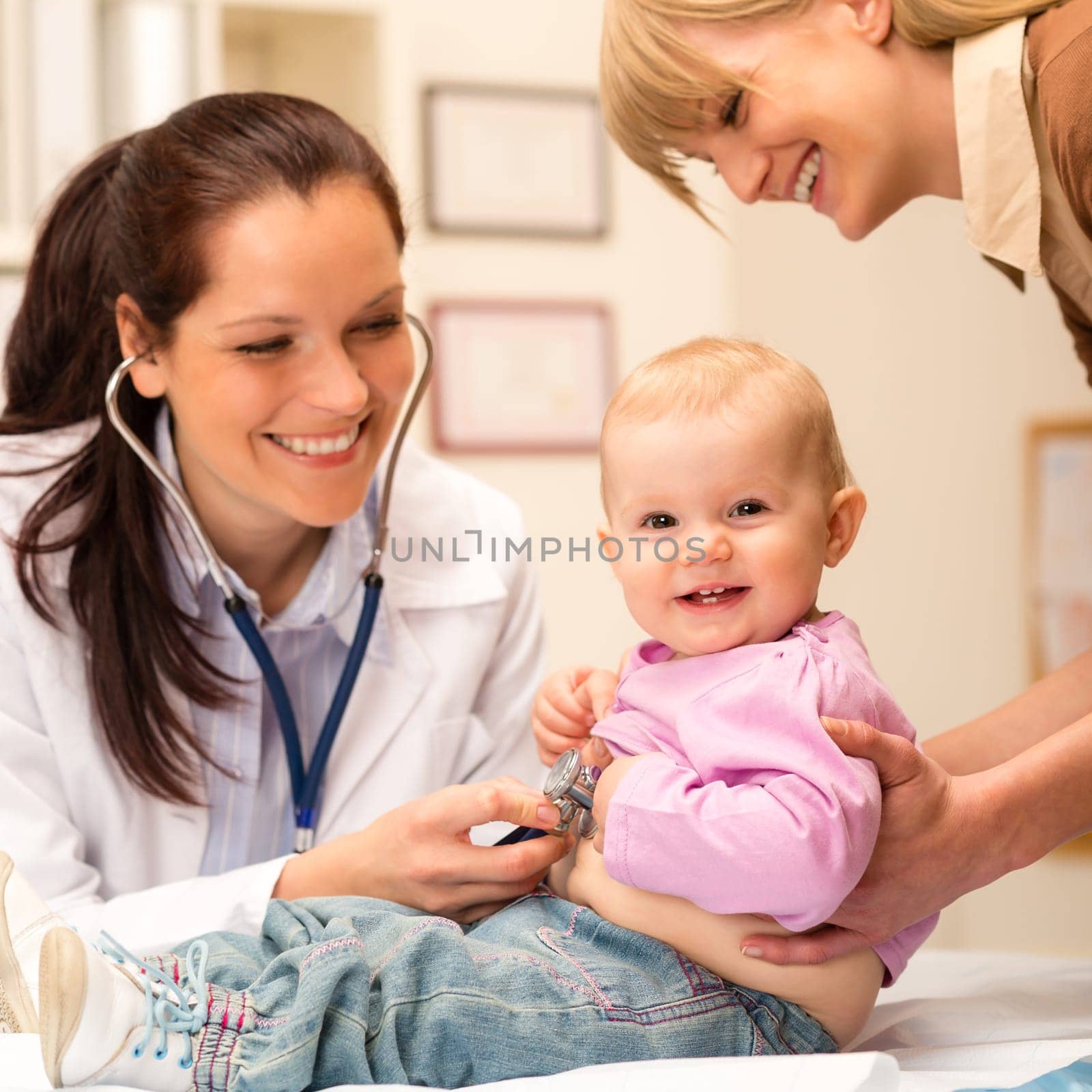 Cute baby being examine by pediatrician with stethoscope