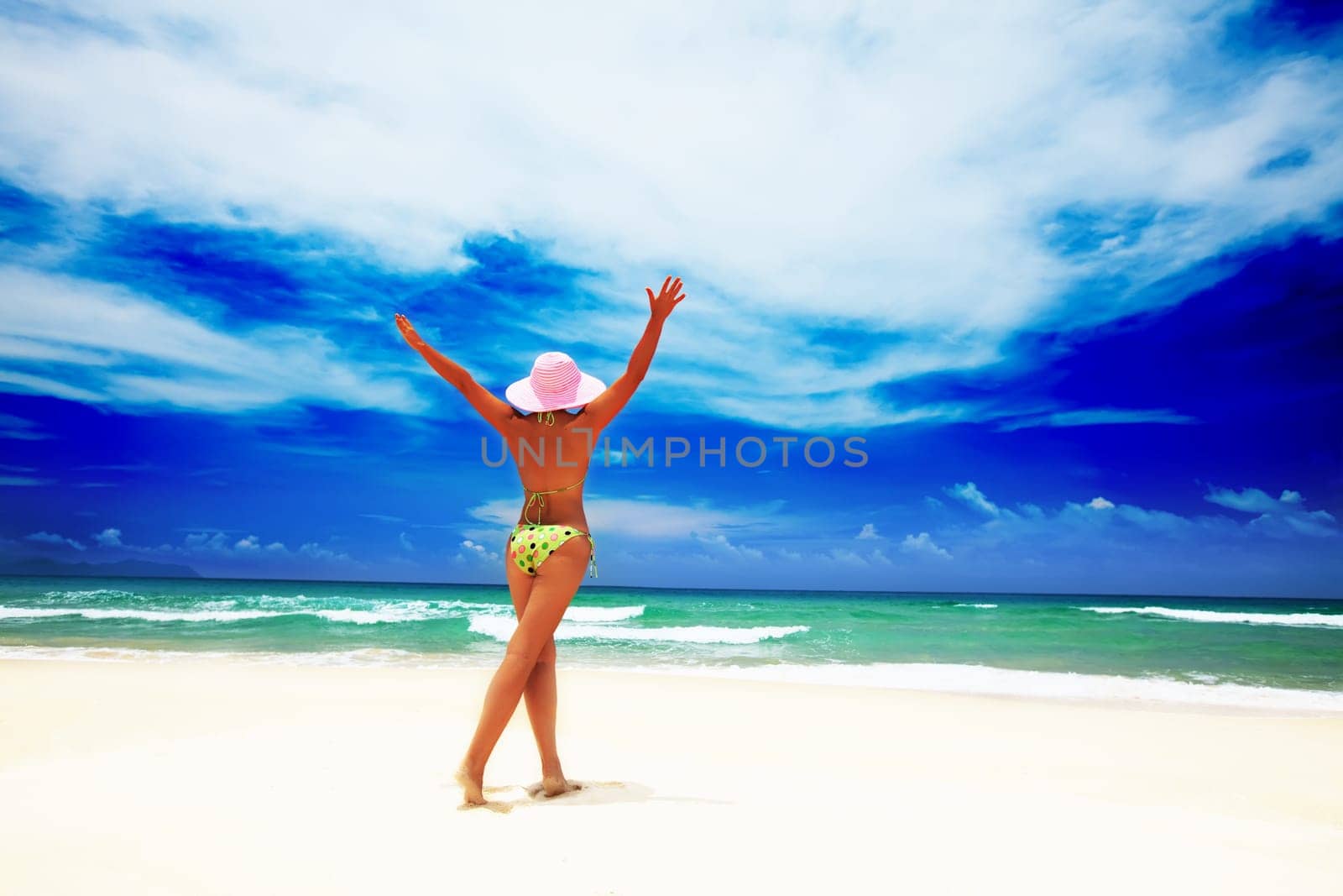Woman have a fun time on the tropical beach