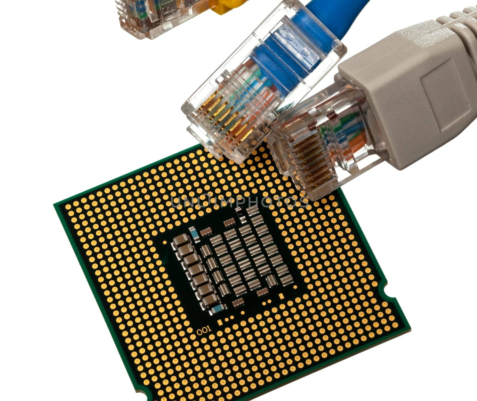 Macro shot of plugs on cat5e cables of many colors isolated against white background on top of exposed CPU chip