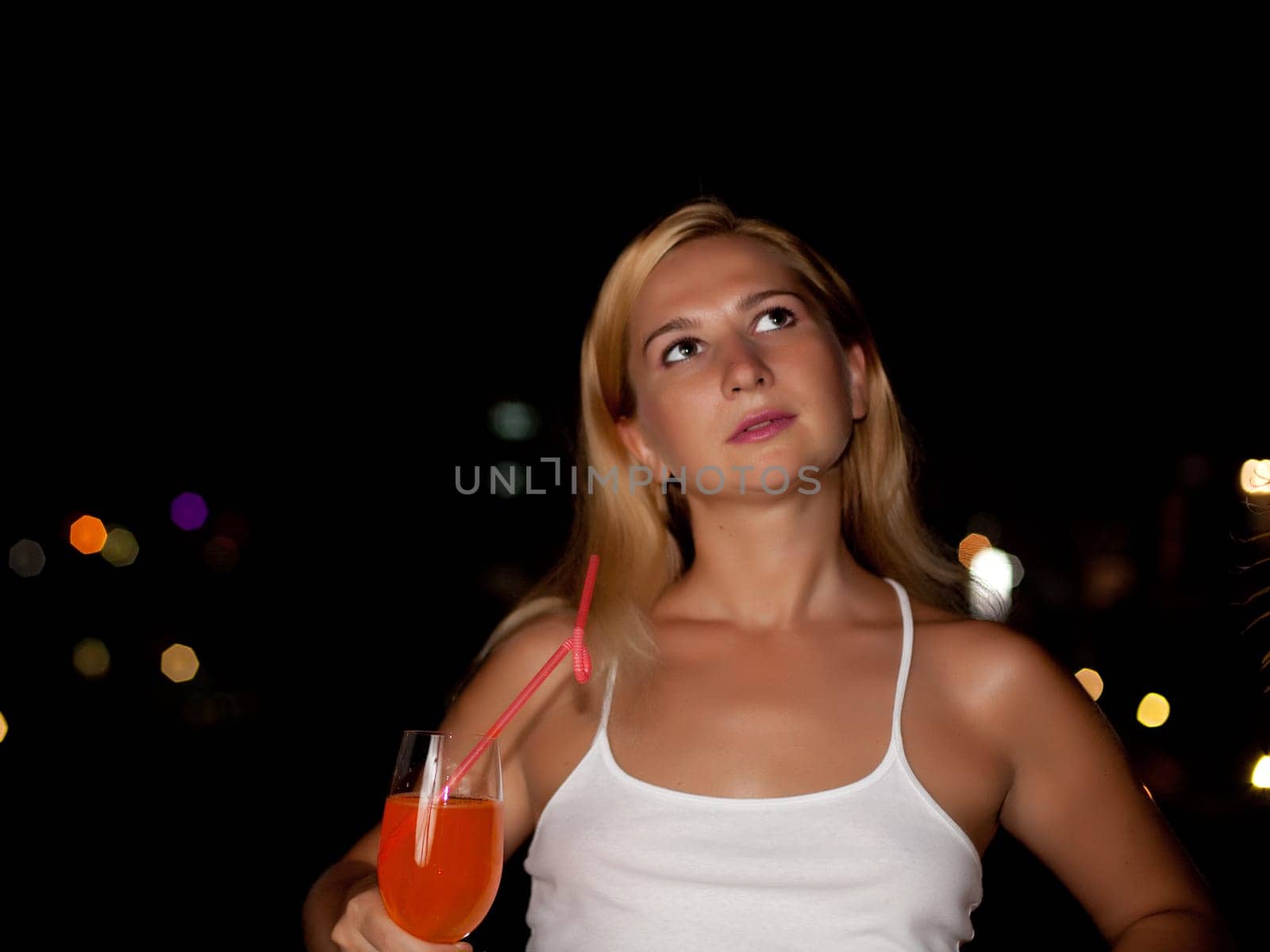 Woman over night city background