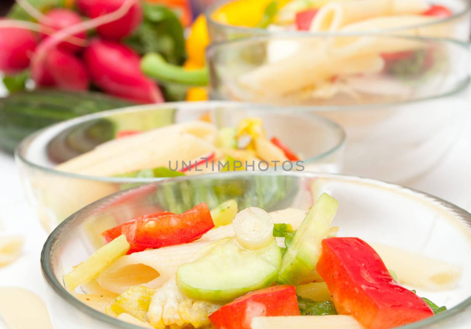 Fresh Pasta Salad With Tomatoes, Pepper, Cucumber, Radish and Lettuce