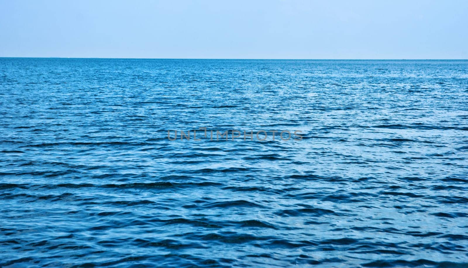 photo of beautiful deep calm blue sea water