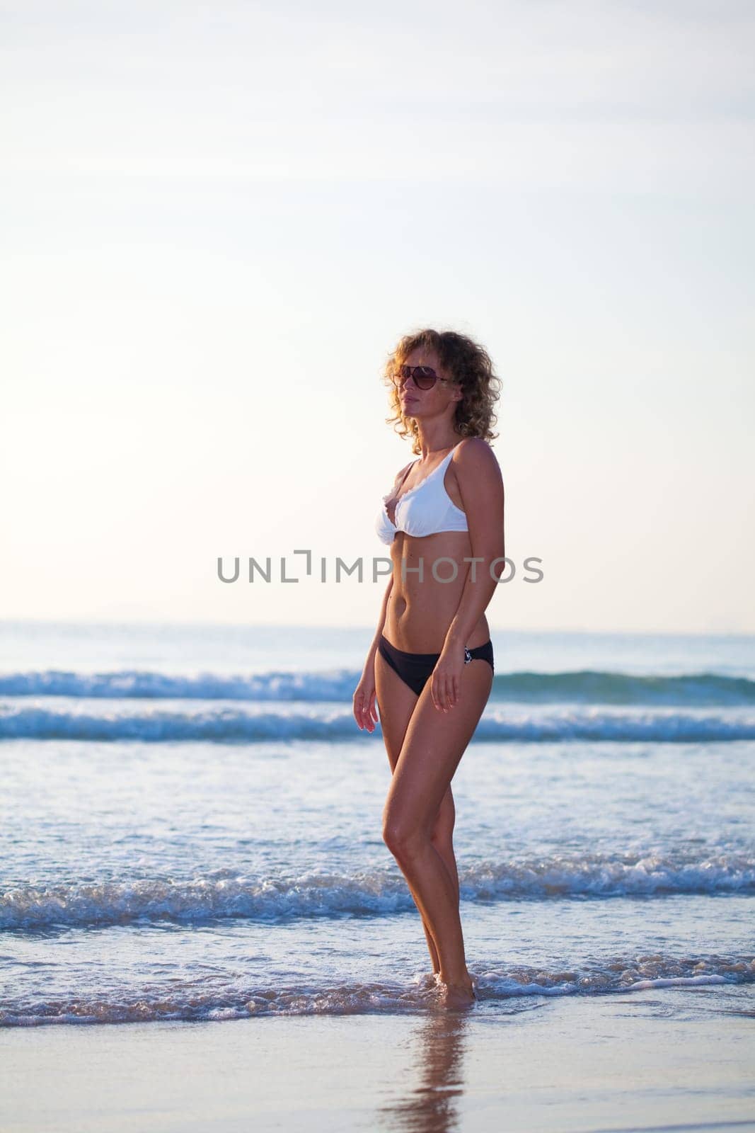 Young woman posing in the ocean water