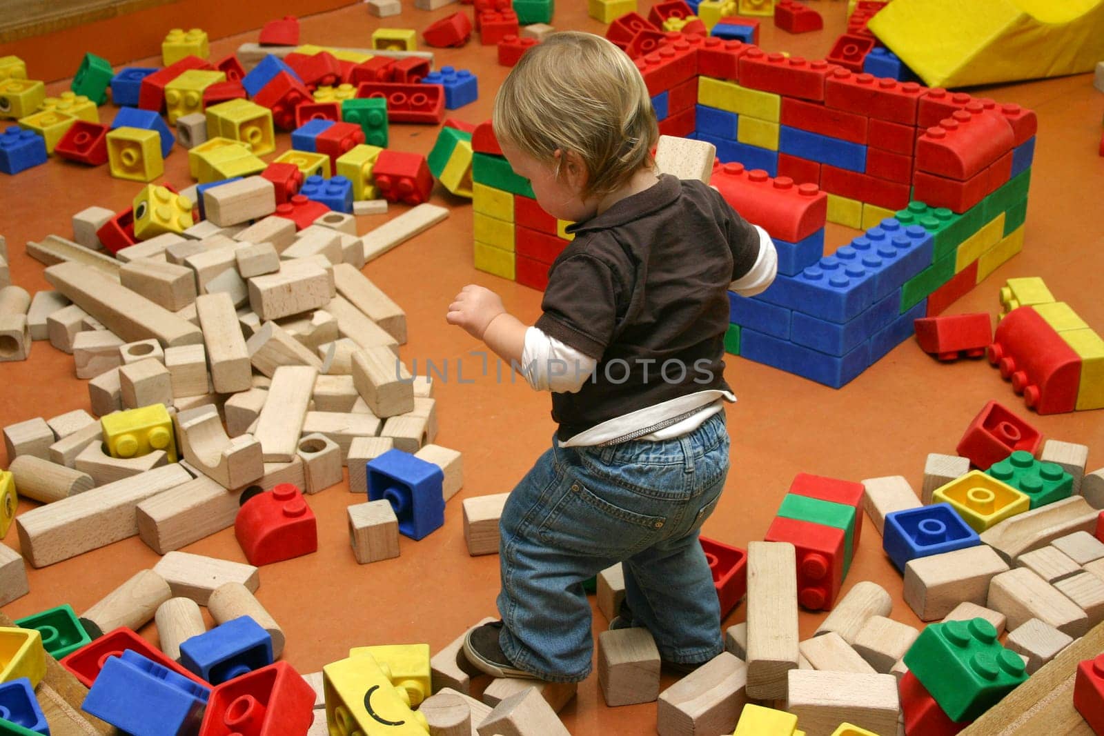 Little boy playing with building blocks