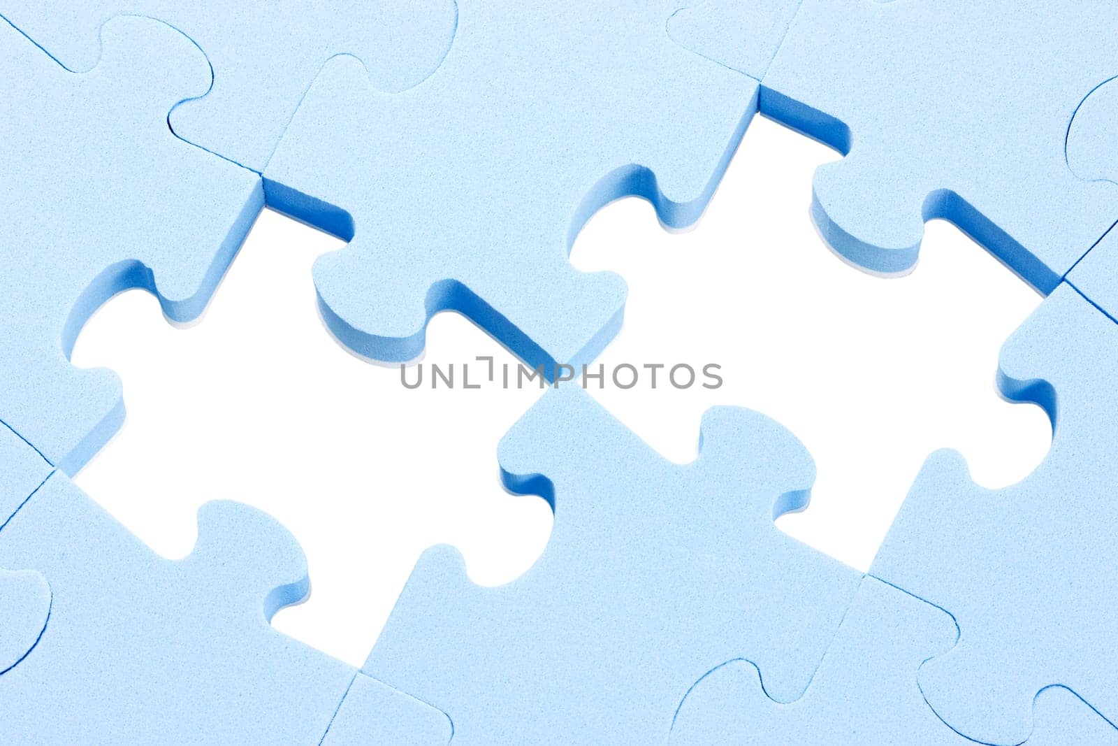 blue puzzle background with two missing pieces