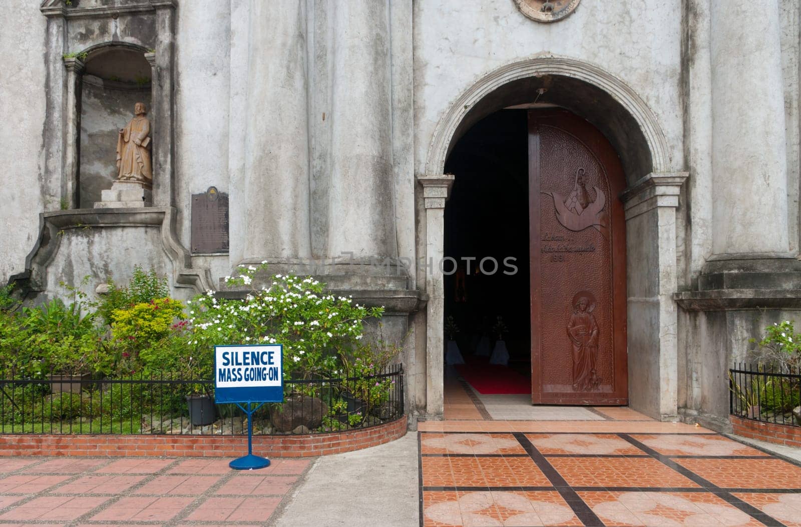 shield in front of a church saying that a mass in going on