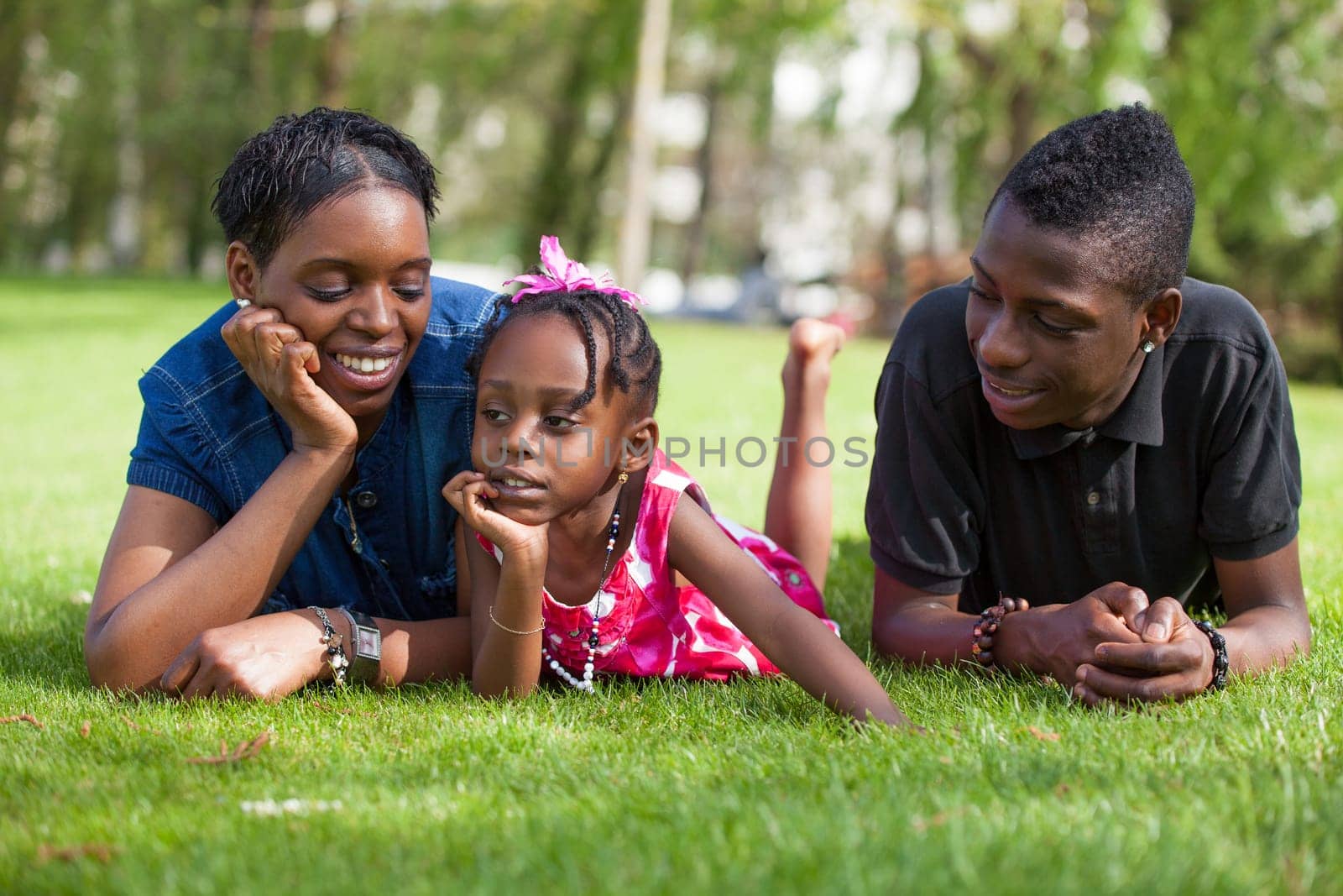 Portrait of a adorable african mother with her childrens in the garden
