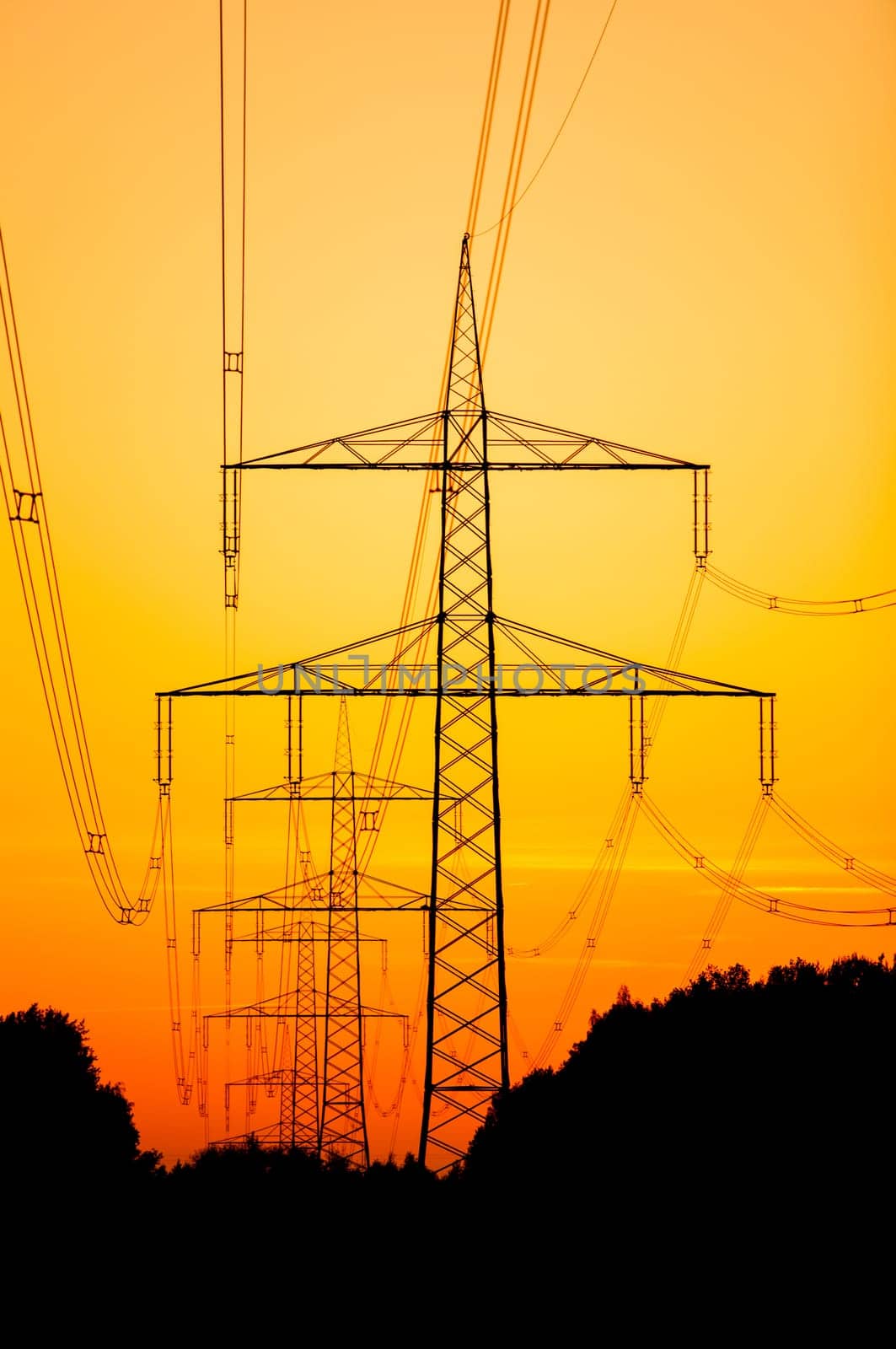 Electricity pylons at sunset