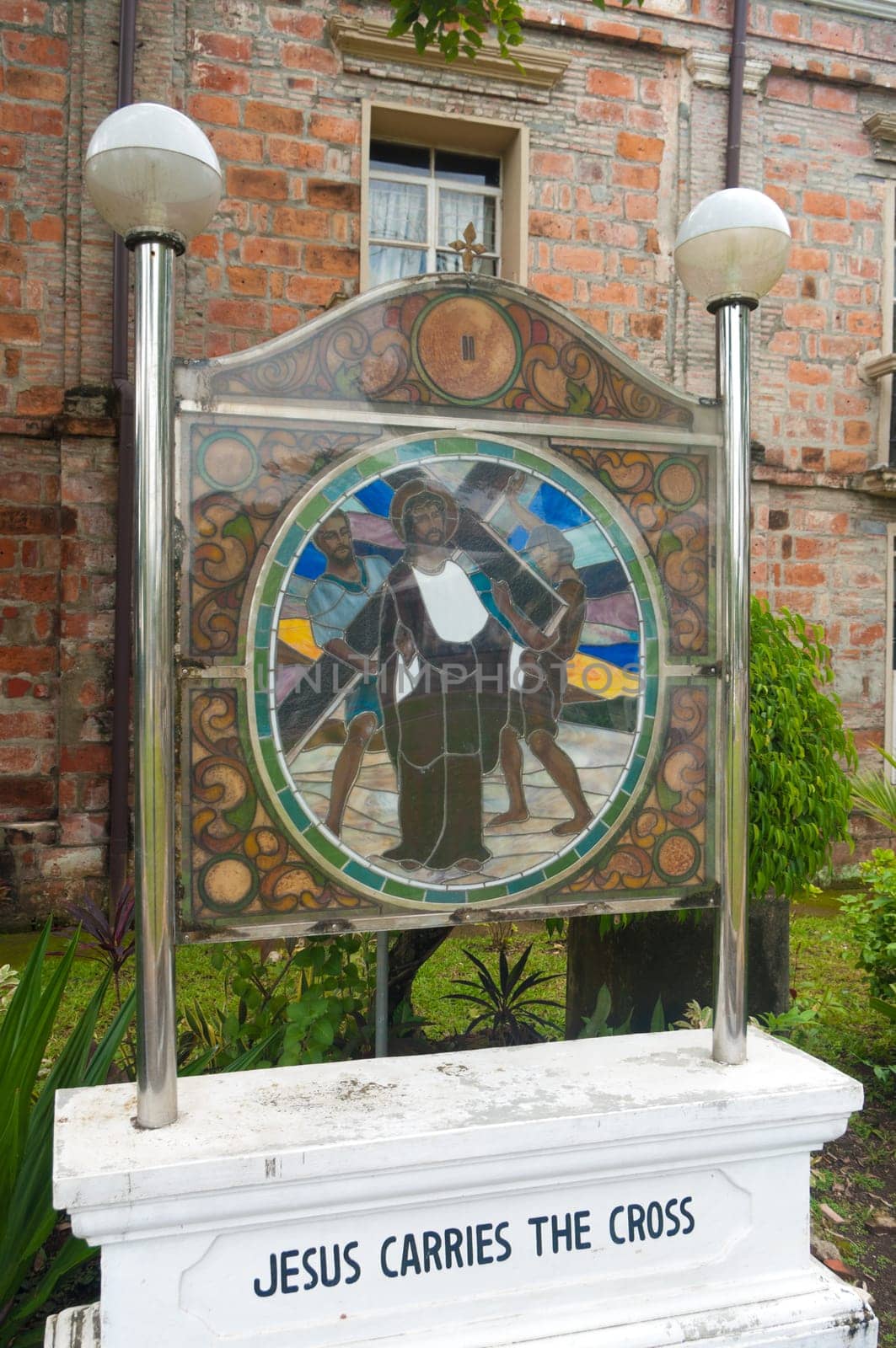 stained glass with religious text in Naga City, Philippines