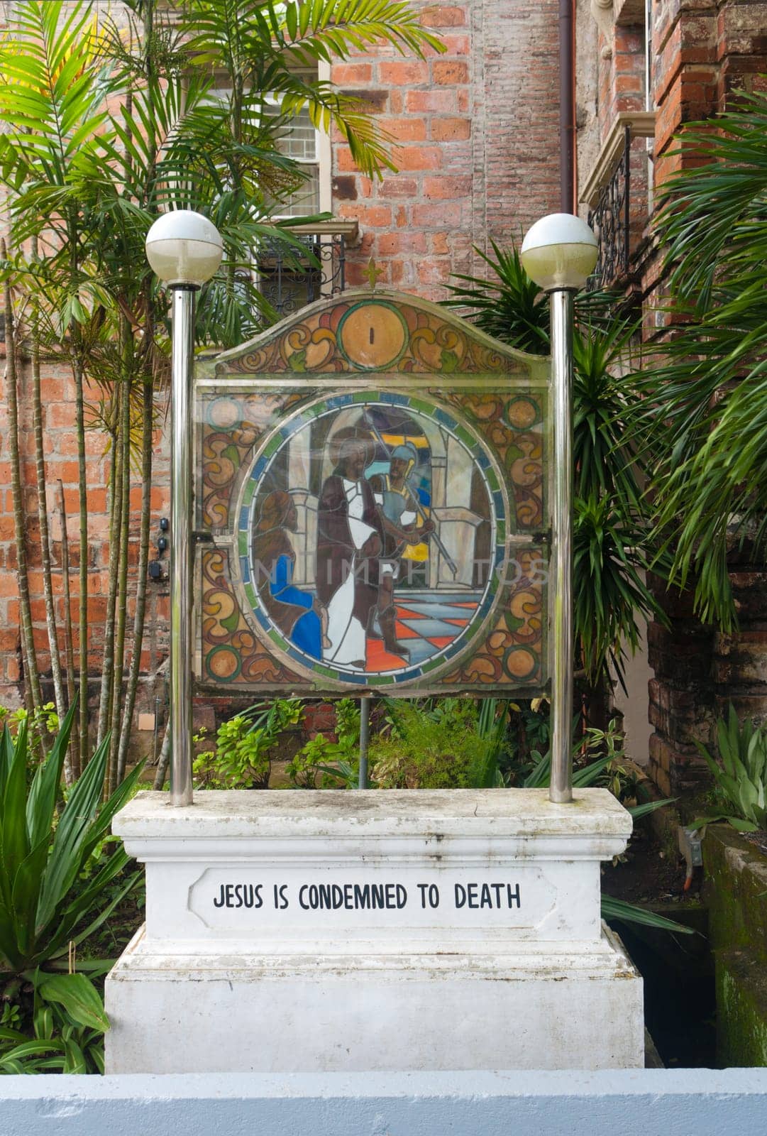 stained glass with religious text in Naga City, Philippines
